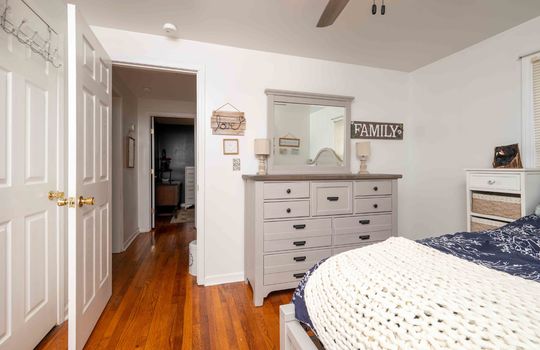 bedroom, door, hardwood flooring, ceiling fan