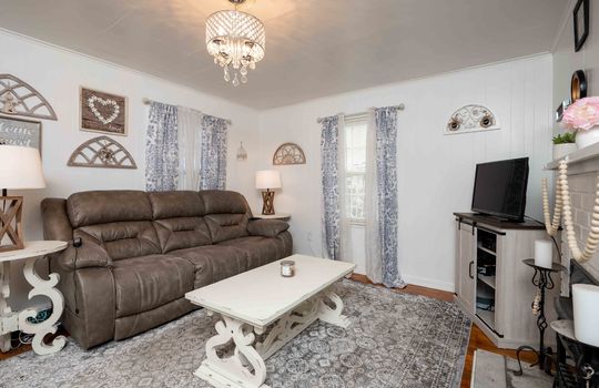 living room, hardwood flooring, window, chandelier