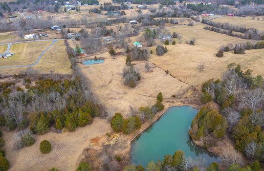 Aerial View of Property From Ponds toward barn