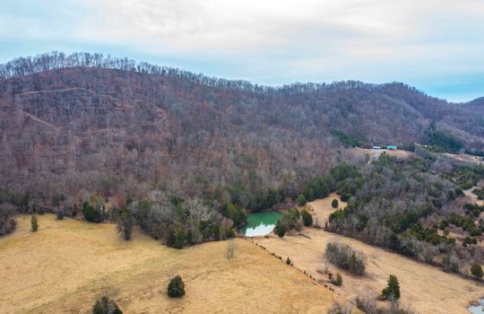 Aerial View of property, field, back pond, mountains