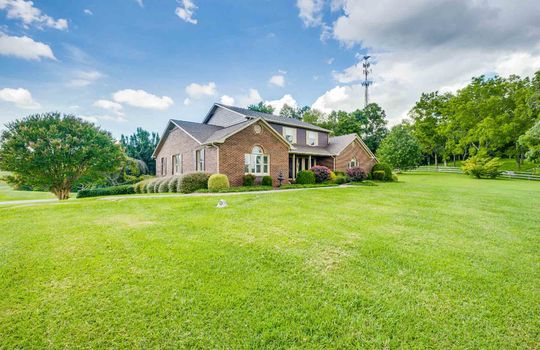 2 story brick ranch, view from left, yard, landscaping