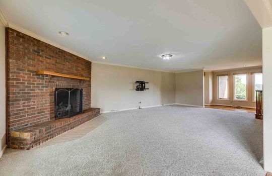 family room/den, brick fireplace, carpet