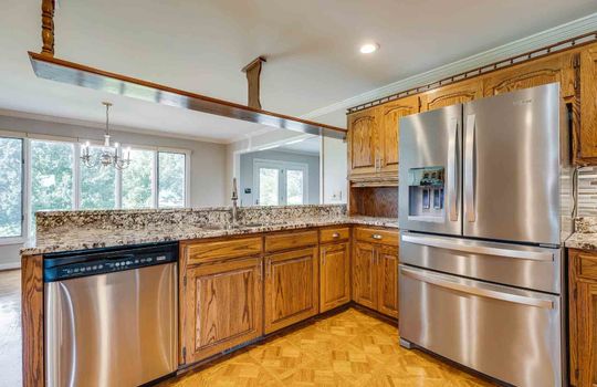kitchen, cabinets, refrigerator, granite counters, dishwasher, parquet flooring