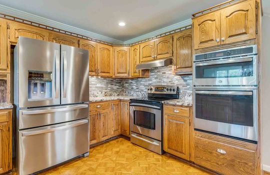 kitchen, wall oven, range/stove, refrigerator, cabinets