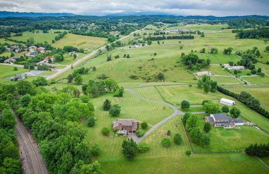 Aerial View from back of property, Yard, Field, Landscaping, Driveway, Road, Mountains