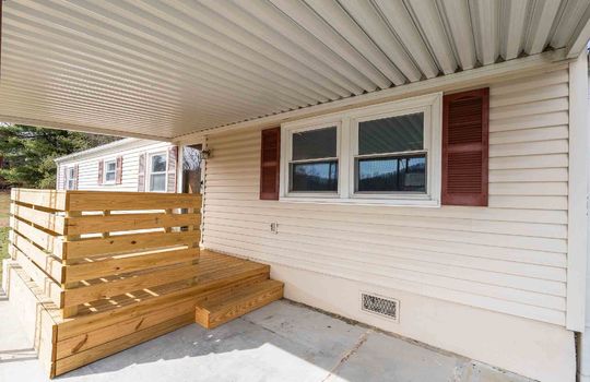 covered wooden deck, front porch, front door