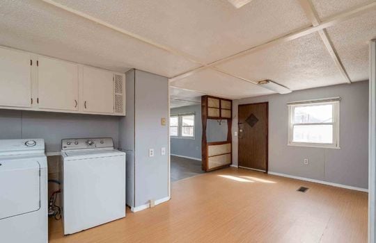 Laundry area, cabinets, kitchen