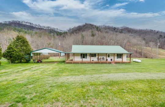 1 story, vinyl siding, yard, mountains, front porch, front door
