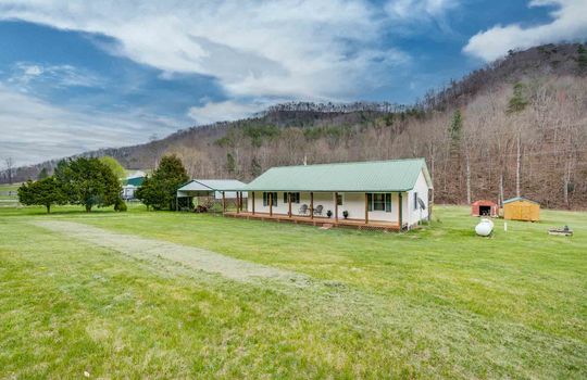 1 story, vinyl siding, yard, mountains, front porch, front door