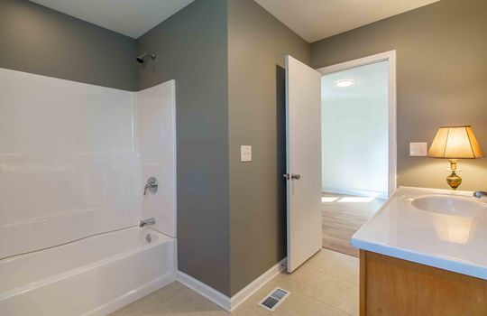 primary bath, tub/shower, sink, cabinet