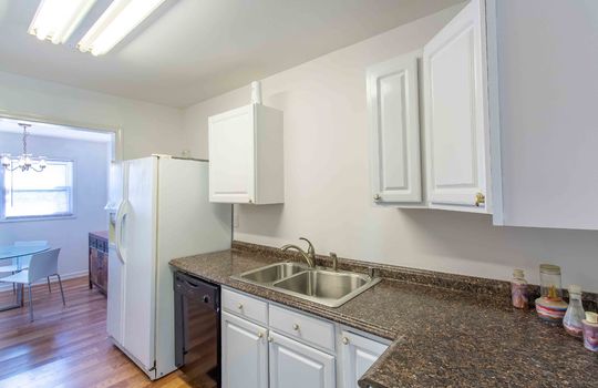 kitchen, sink, cabinets, laminate flooring, refrigerator