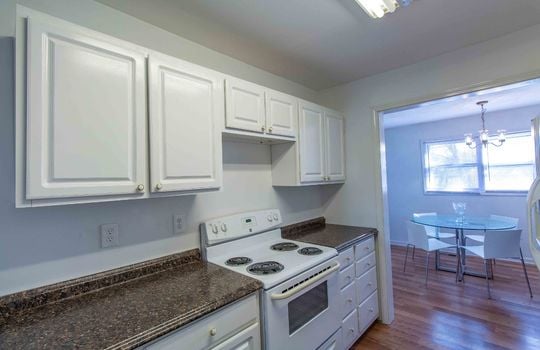 kitchen, cabinets, stove, laminate flooring