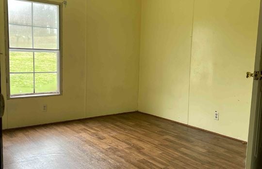 room, closet, ceiling fan, laminate flooring, window