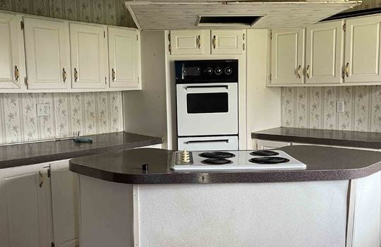 kitchen, island, in island stovetop, wall oven, white cabinets