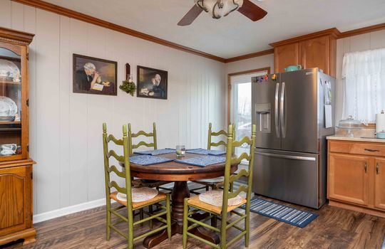 eat-in kitchen, refrigerator, ceiling fan, cabinets, window