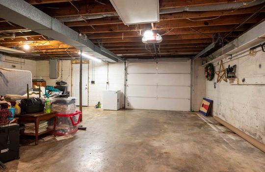 garage interior, concrete flooring, garage door