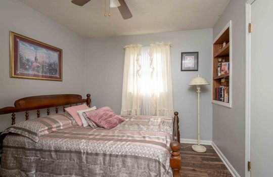 bedroom, window, built-in shelving, ceiling fan