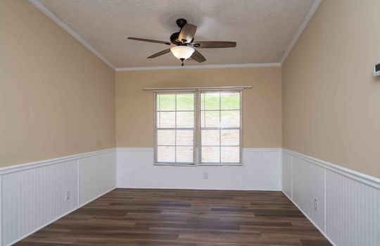 dining area, wainscoting, luxury vinyl flooring, ceiling fan