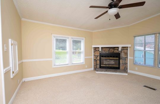 living room, windows, fireplace, ceiling fan, carpet