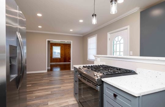 kitchen, stove, granite counter tops, dining area