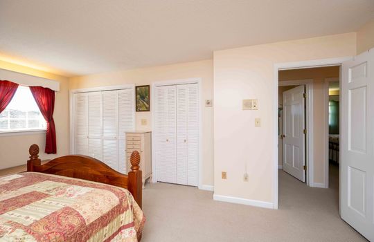 primary bedroom, double closets, door to hallway, carpet