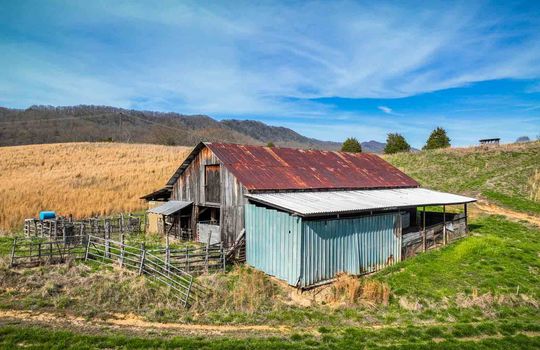 barn, fencing, trees, mountains