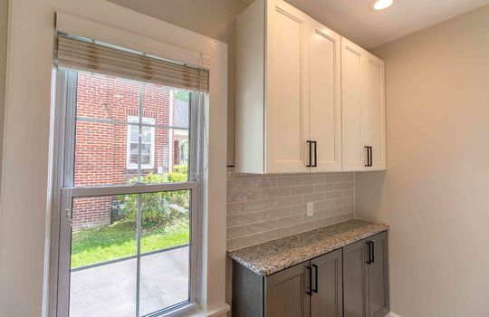 window, eat-in kitchen cabinetry, backsplash, recessed lighting