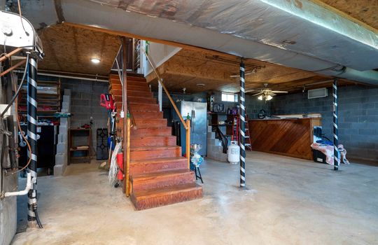 basement, concrete flooring, stairs