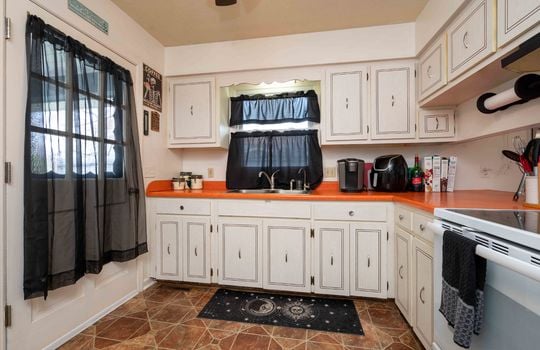 kitchen, cabinets, stove, vinyl flooring, sink