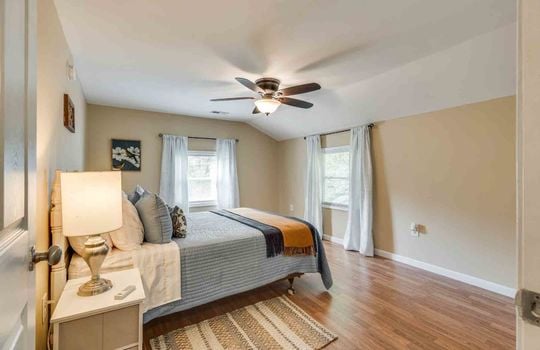 bedroom, laminate flooring, windows, ceiling fan