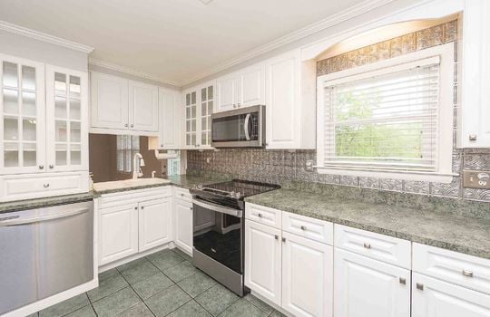 kitchen, tile flooring, dishwasher, stove, sink, window, cabinets