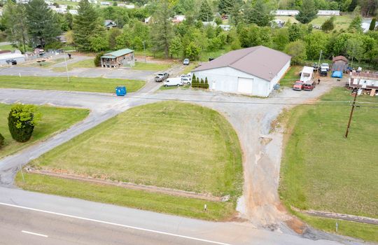 Aerial view of commerical property, road, driveway, gravel driveway
