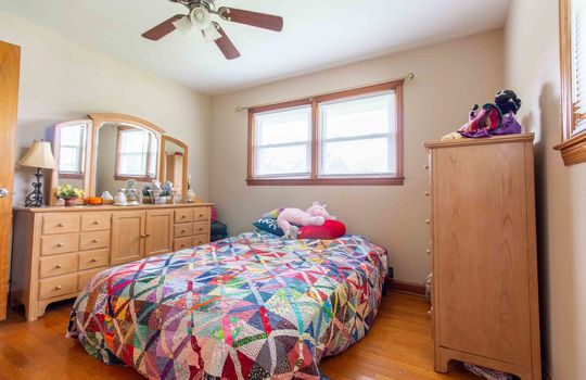 bedroom, hardwood flooring, ceiling fan, window