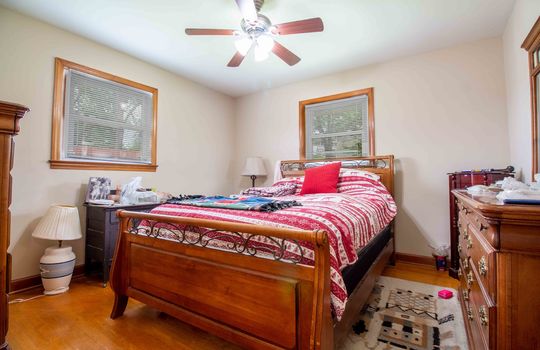 bedroom, hardwood flooring, windows, ceiling fans