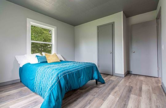 second bedroom, vinyl flooring, window, closet