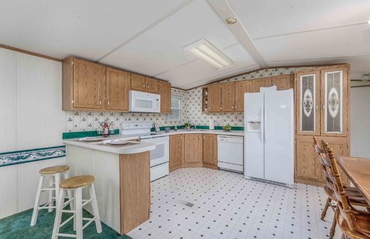 kitchen, vinyl flooring, cabinets, stoves, microwave, dishwasher, refrigerator