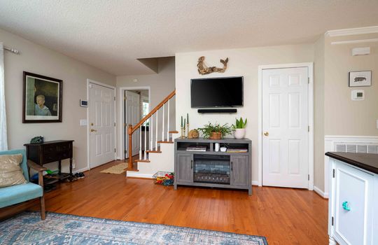 living room, hardwood flooring, closet, stairs