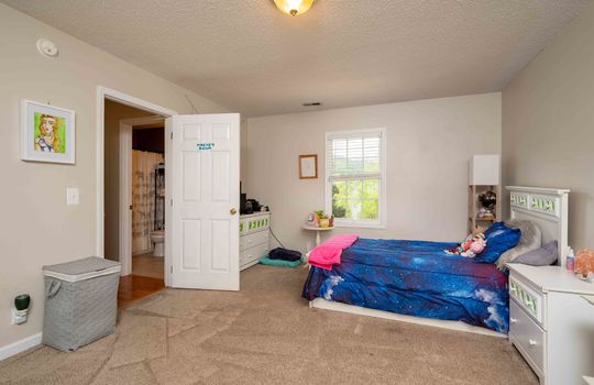 bedroom, carpet, window, door to hallway