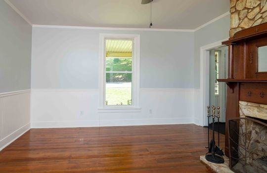 living room, hardwood flooring, fireplace, window