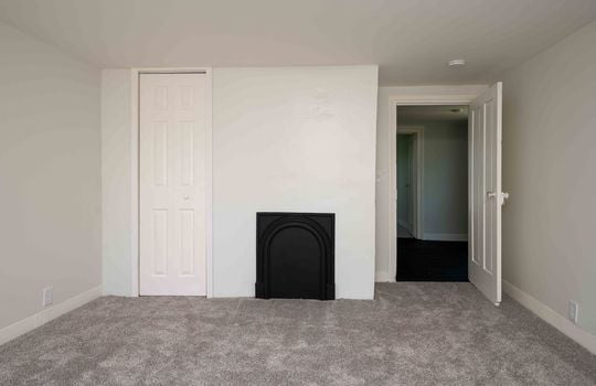 bedroom, carpet, fireplace