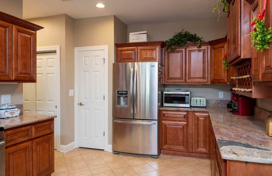 kitchen, granite countertops, tile flooring, refrigerator, cabinets, recessed lighting, pantry