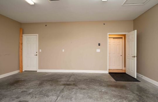 garage, concrete flooring, doorways