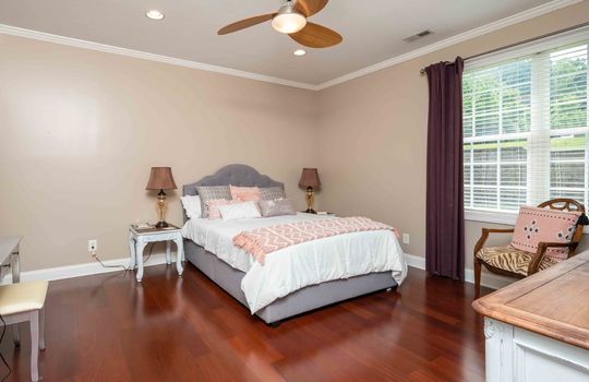 bedroom, cherry hardwood flooring, ceiling fan, window