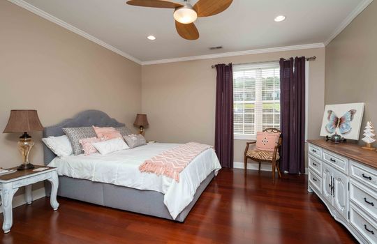 bedroom, cherry hardwood flooring, ceiling fan, window