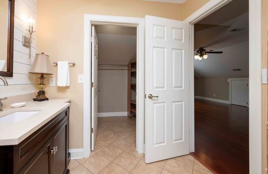 bedroom, cherry hardwood flooring, ceiling fan, ensuite, tile flooring, sink, closet