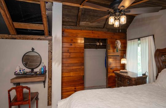 bedroom, wood feature wall, closet, vanity space