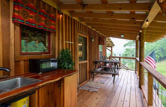 covered back deck, wood deck, outdoor unfinished kitchen space