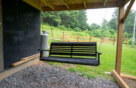 porch swing, covered gravel area