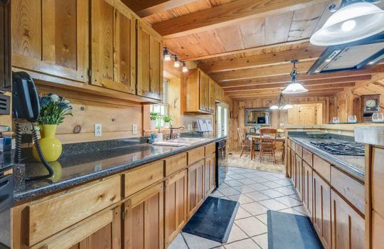 kitchen, tile flooring, wood cabinets, countertops, sink, window, dishwasher