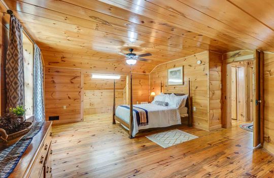 bedroom, wood walls, wood flooring, ceiling fan